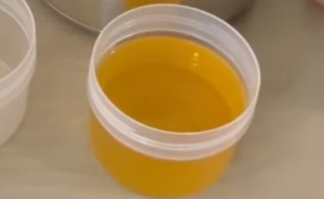 A container of melted palm oil for soap making