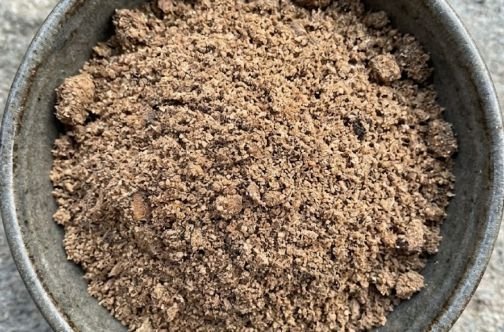 A bowl of palm kernel cake from processing palm oil