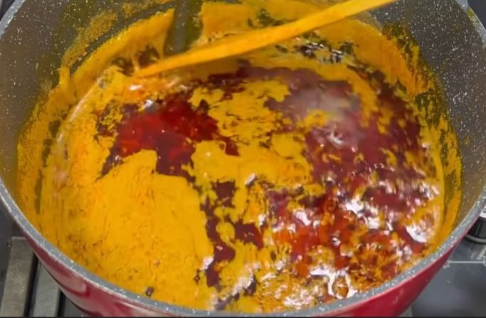 Extraction of red palm oil in progress