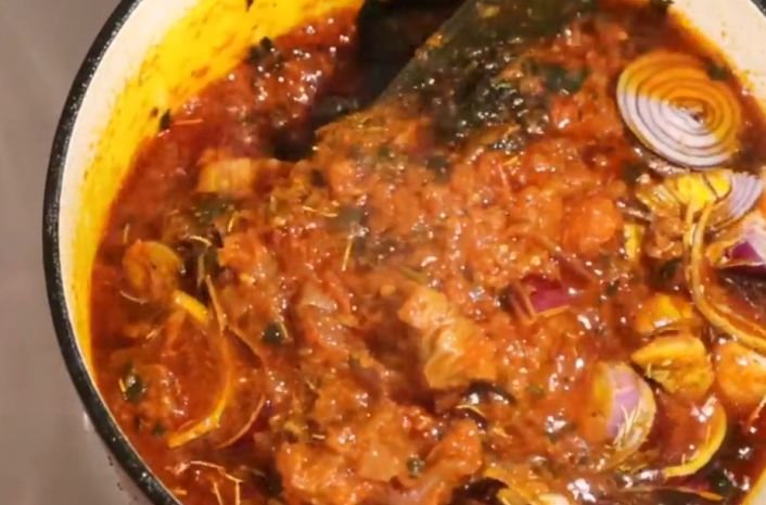 An African kitchen cooking with red palm oil